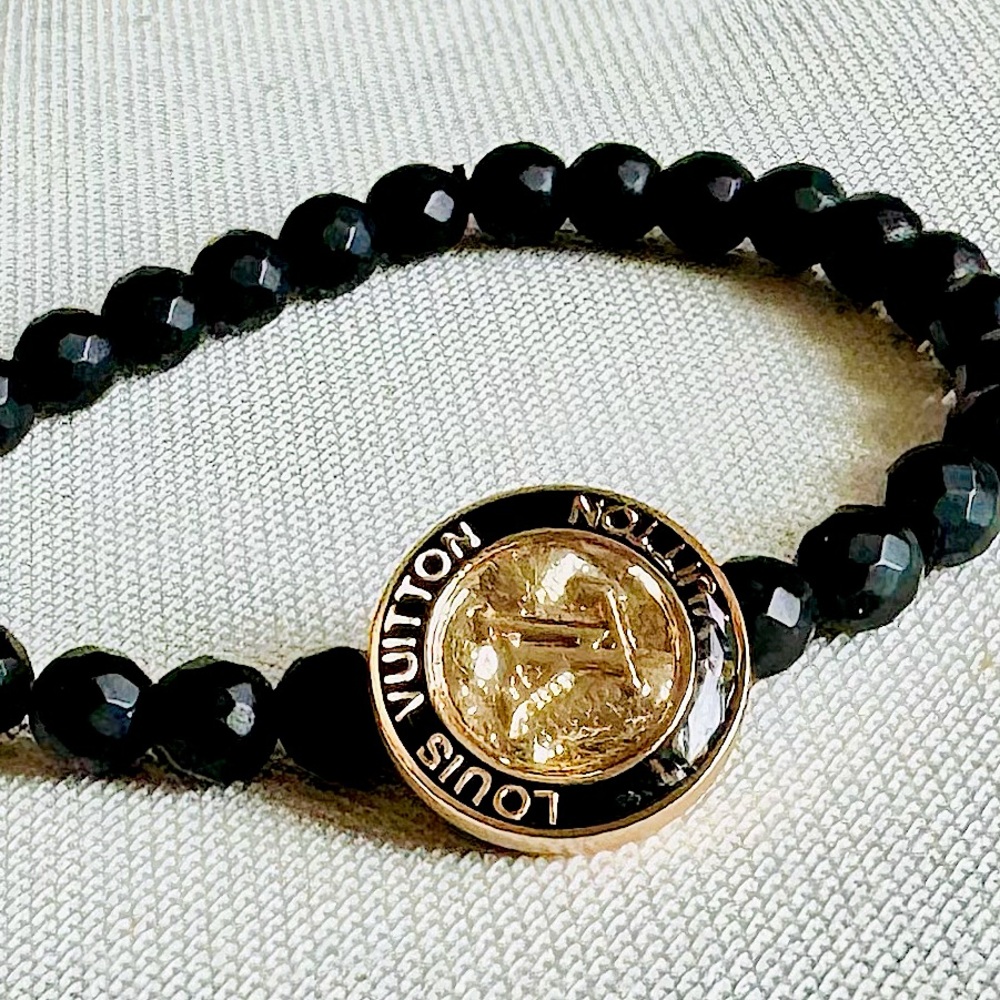 LOUIS VUITTON Black Beaded Bracelet with Gold LV Medallion